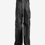 Black pants worn by a person, showing the pants' fit