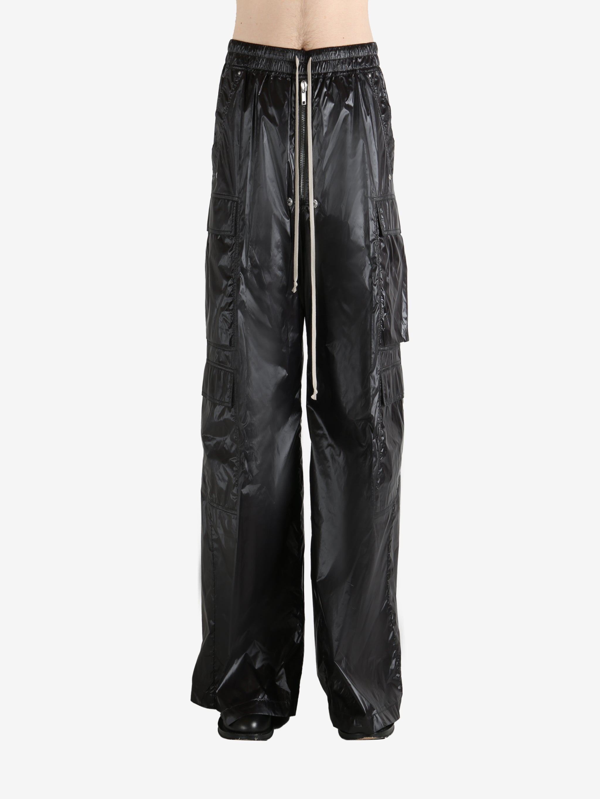 Black pants worn by a person, showing the pants' fit