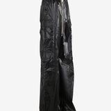 Black pants worn by a person, showing the pants' fit