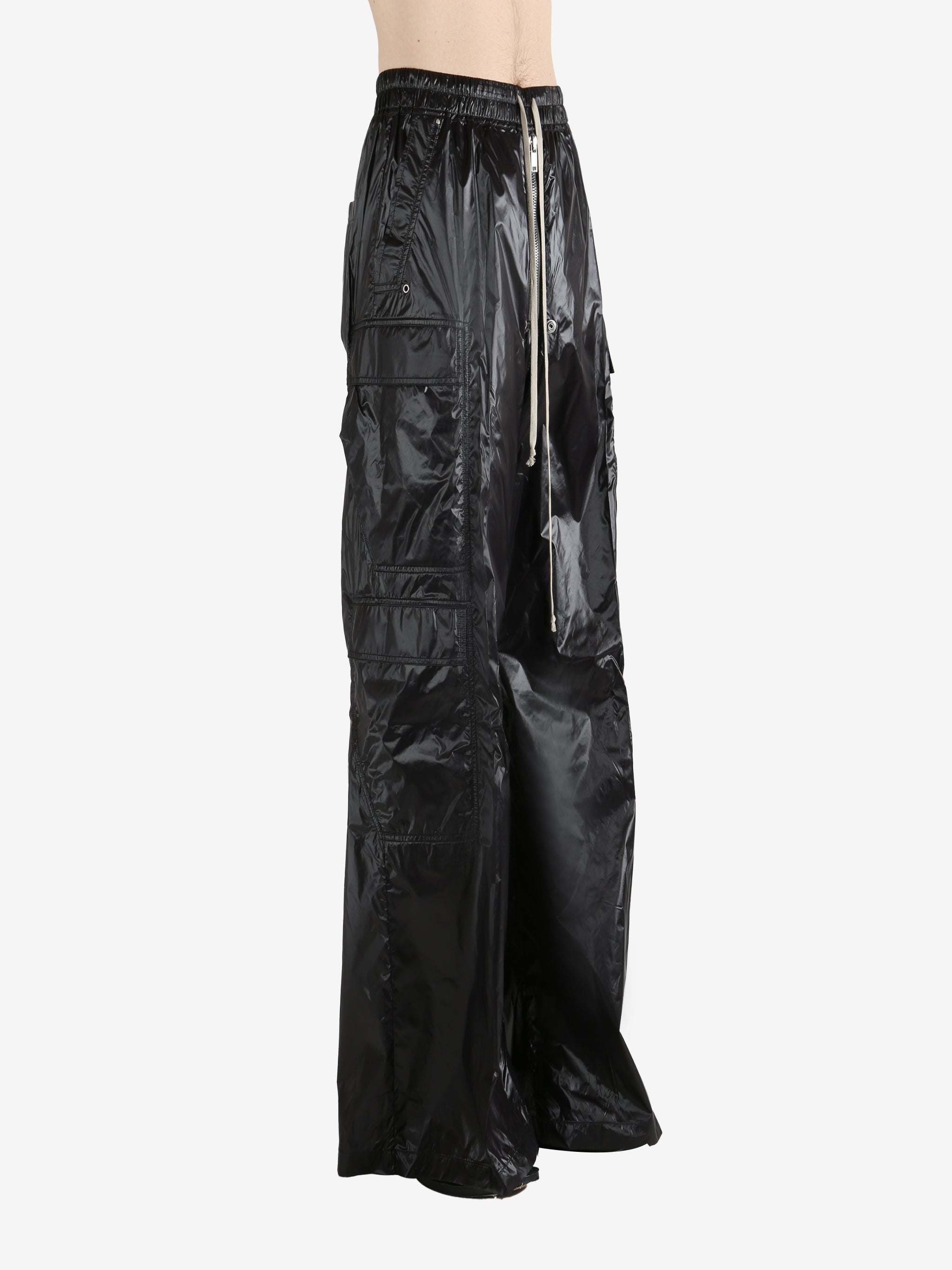 Black pants worn by a person, showing the pants' fit