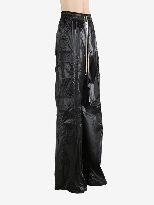 Black pants worn by a person, showing the pants' fit