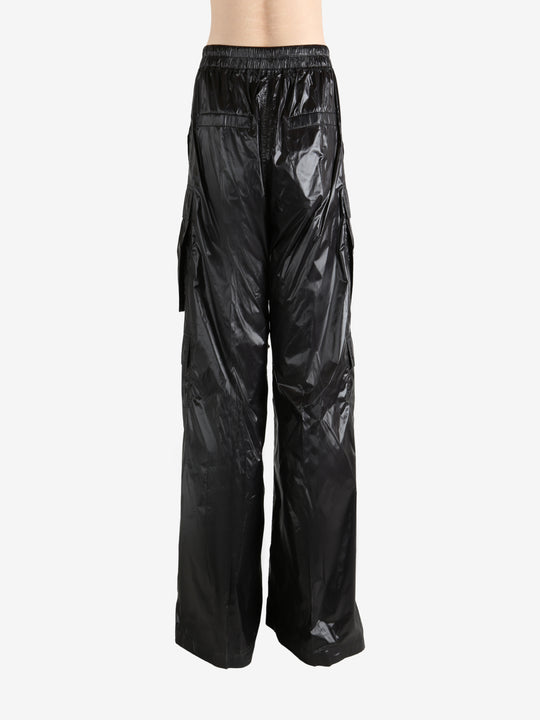 Black pants worn by a person, showing the pants' fit