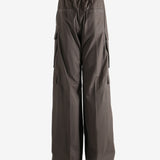 Brown pants worn by a person, showing the pants fit