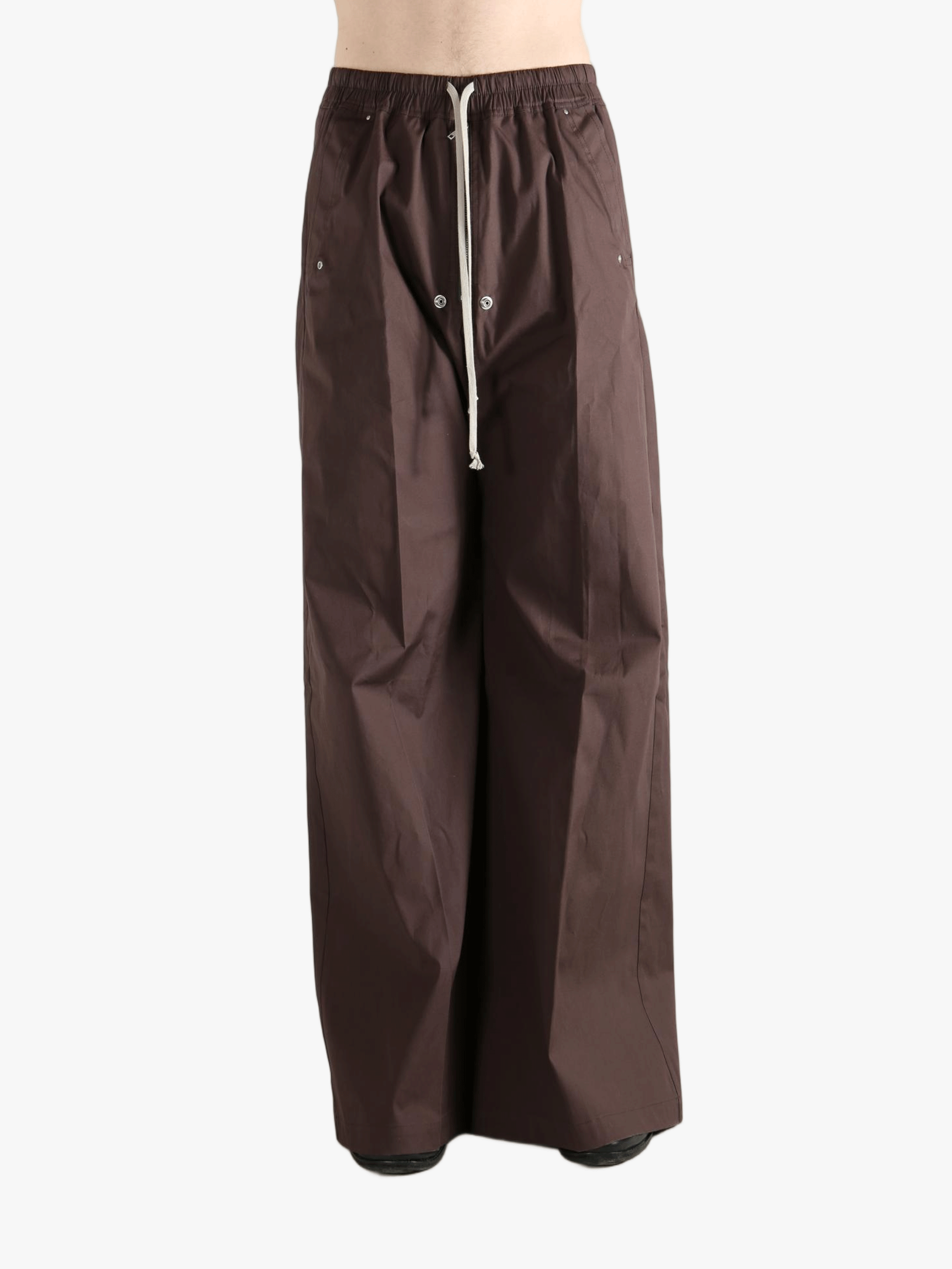 Brown pants worn by a person, showing the pants' fit