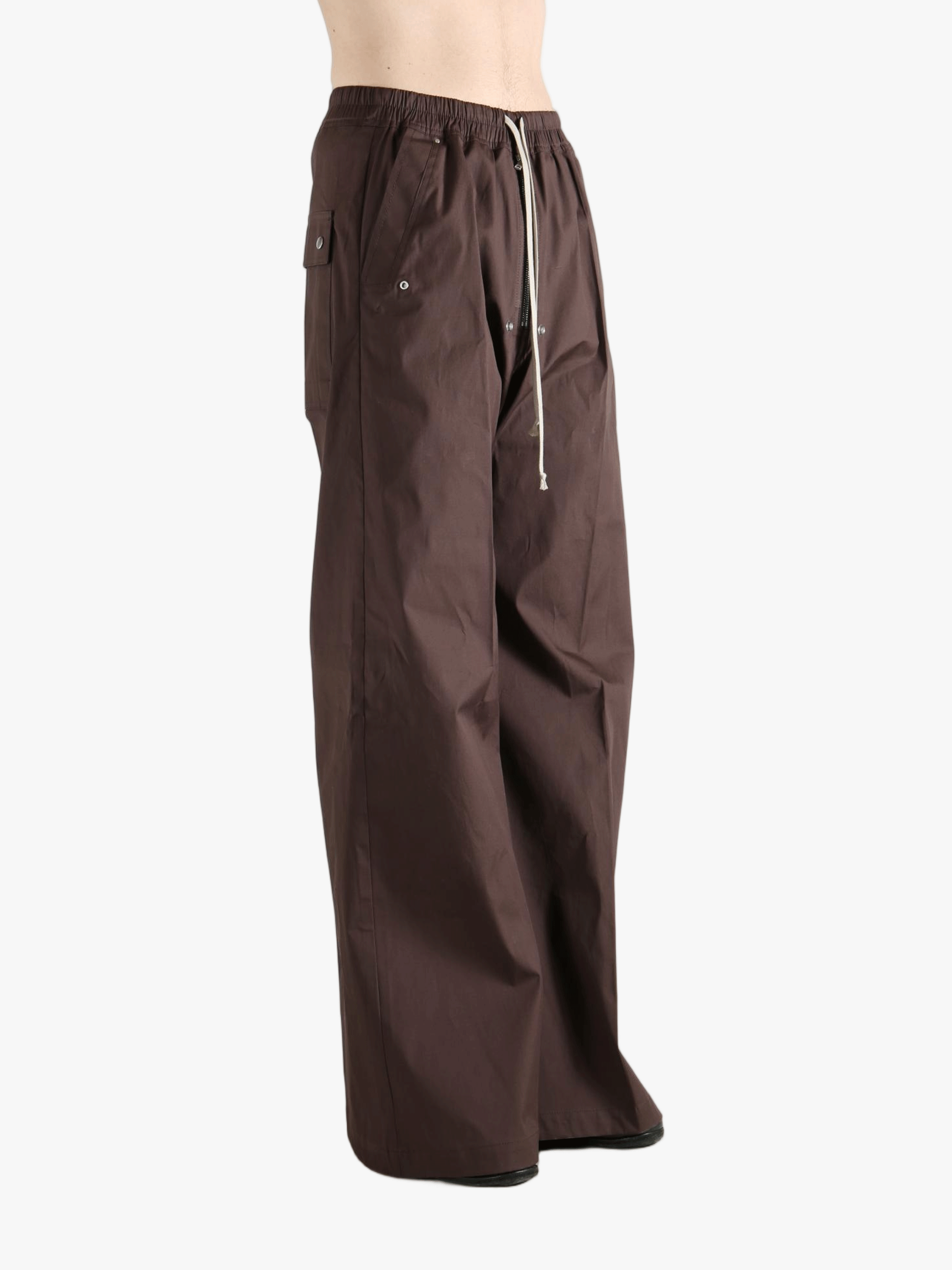 Brown pants worn by a person, showing the pants' fit