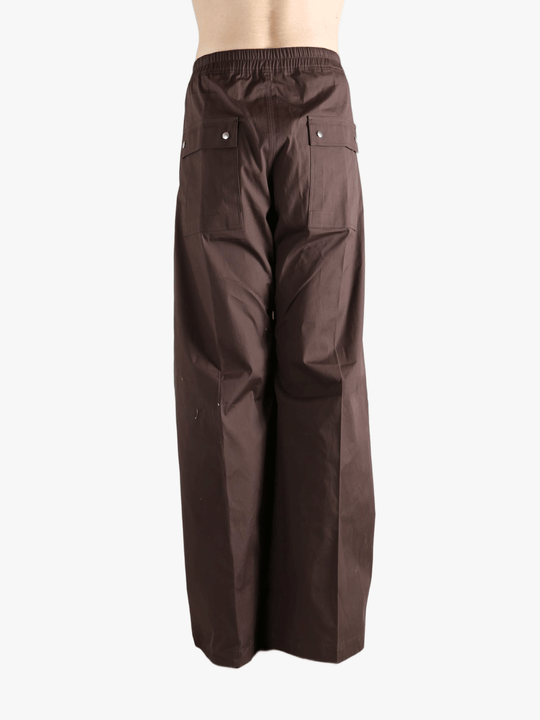 Brown pants worn by a person, showing the pants' fit