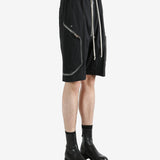 Black shorts worn by a person, showing the shorts' fit