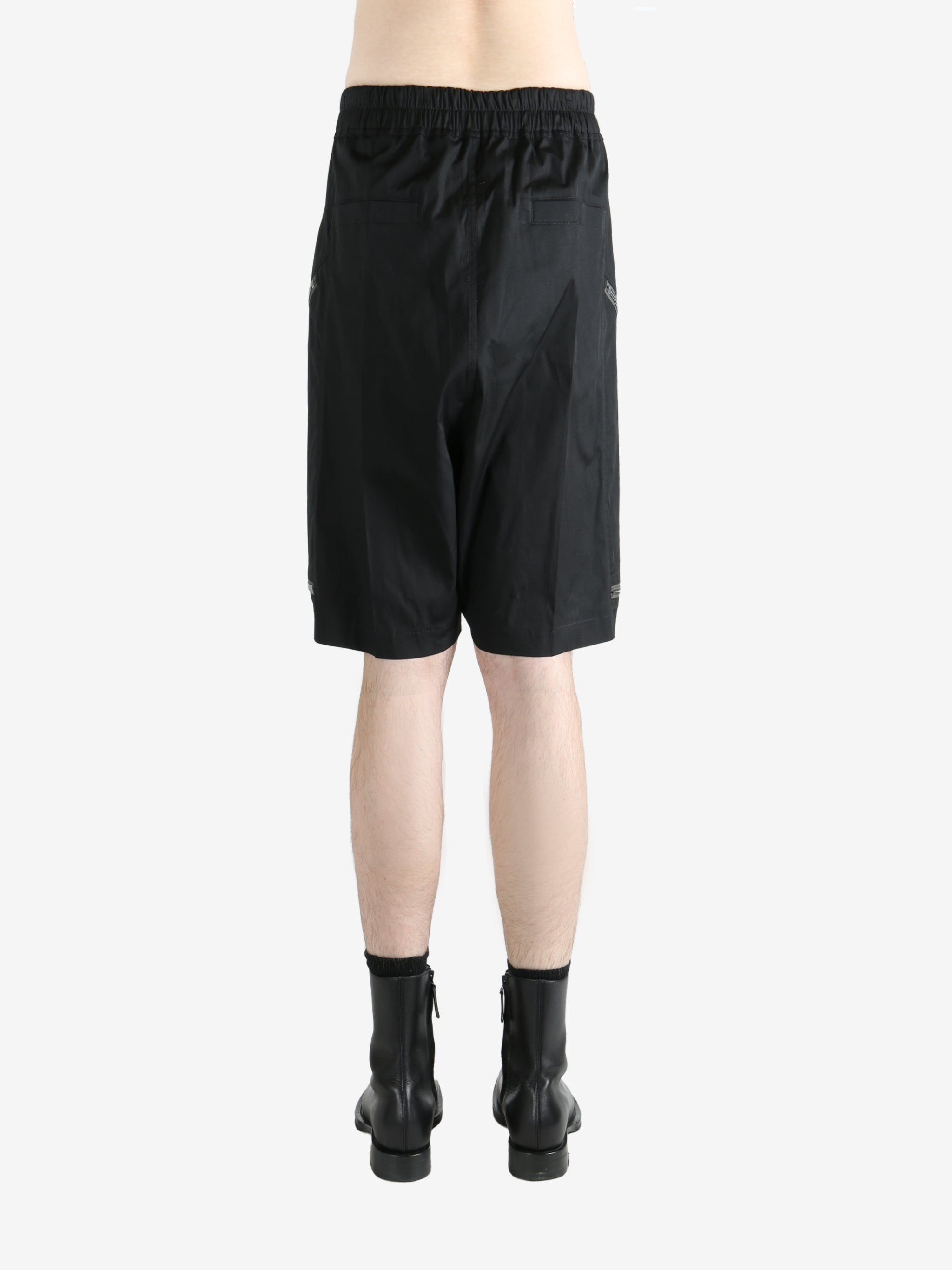 Black shorts worn by a person, showing the shorts' fit