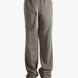 Grey pants worn by a person, showing the pants' fit