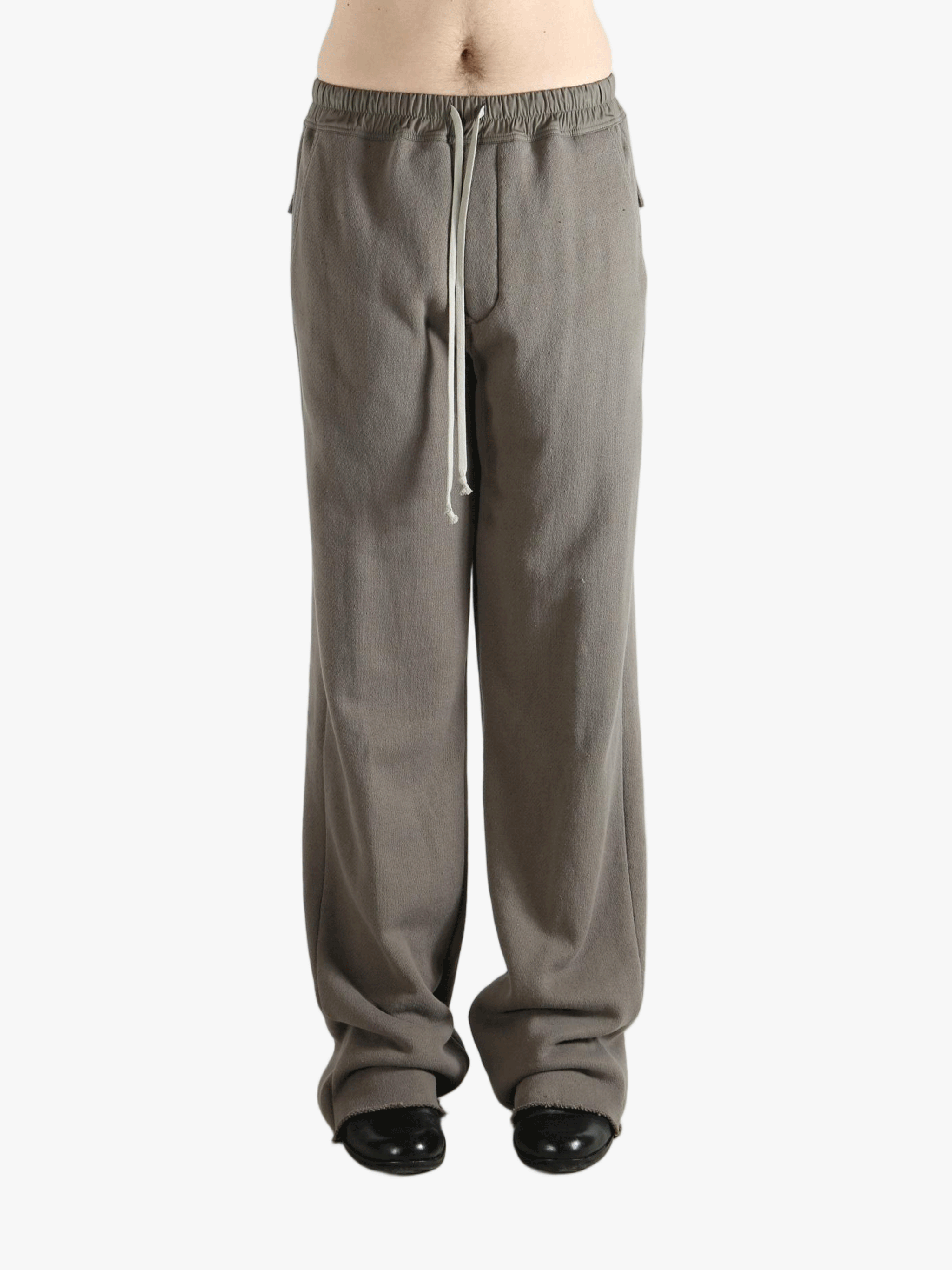 Grey pants worn by a person, showing the pants' fit