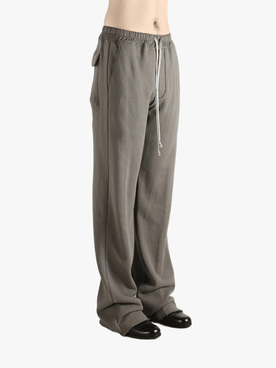 Grey pants worn by a person, showing the pants' fit