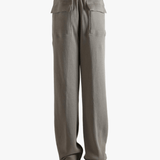 Grey pants worn by a person, showing the pants' fit