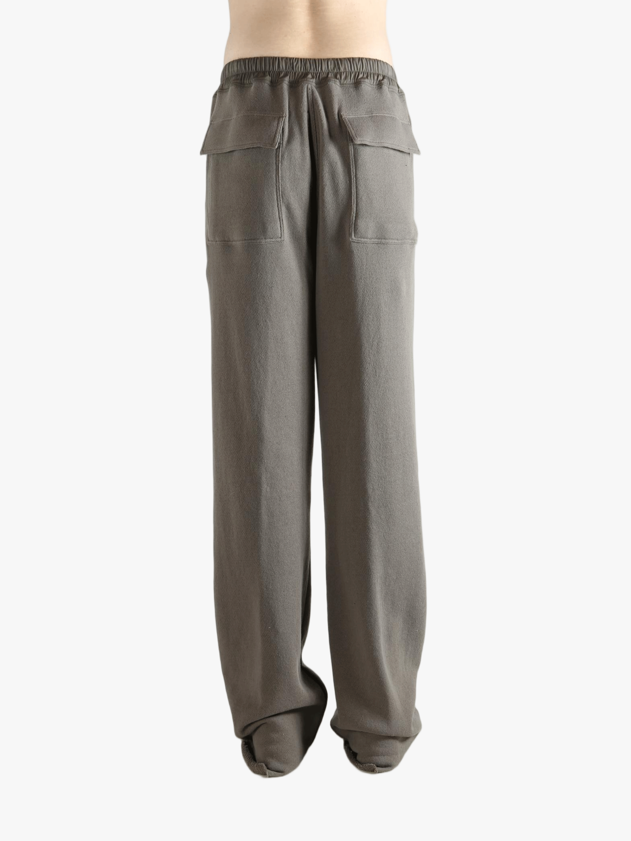 Grey pants worn by a person, showing the pants' fit