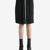 Black shorts worn by a person, showing the shorts fit