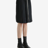 Black shorts worn by a person, showing the shorts fit