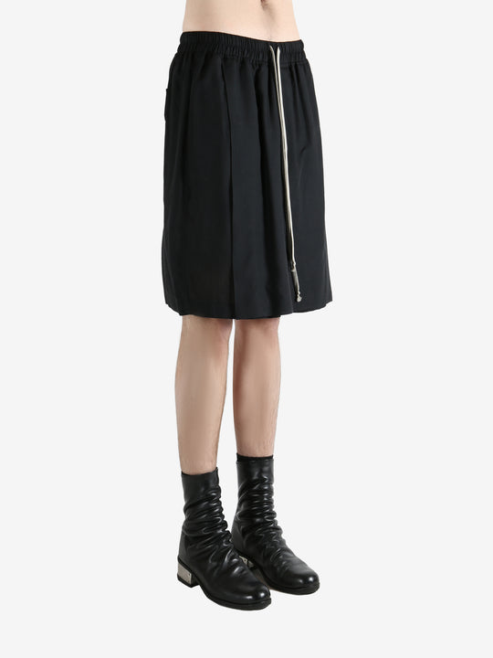 Black shorts worn by a person, showing the shorts fit