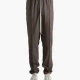 Brown pants worn by a person, showing the pants fit