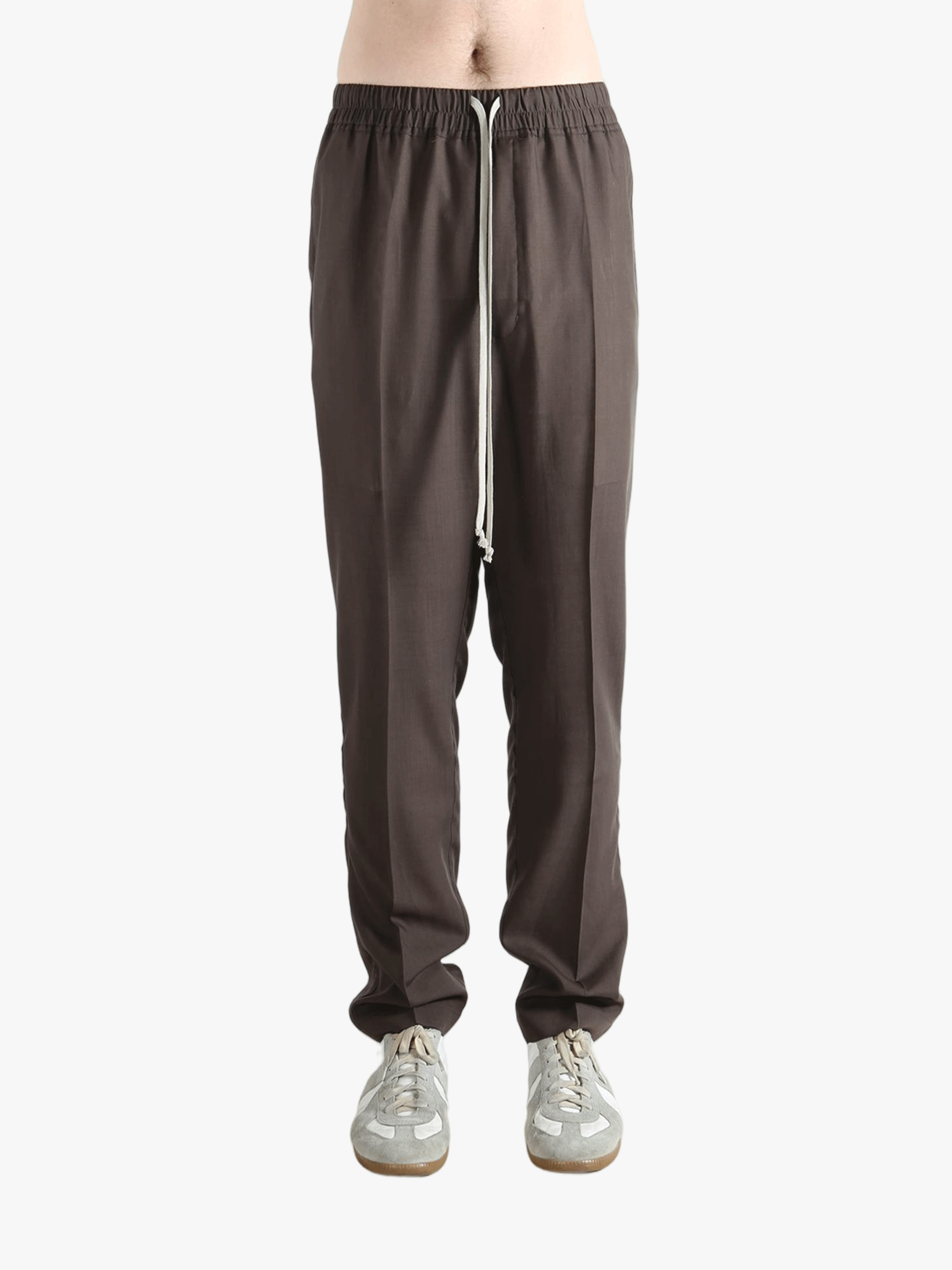 Brown pants worn by a person, showing the pants fit