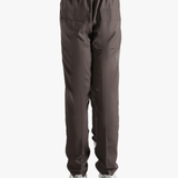 Brown pants worn by a person, showing the pants fit