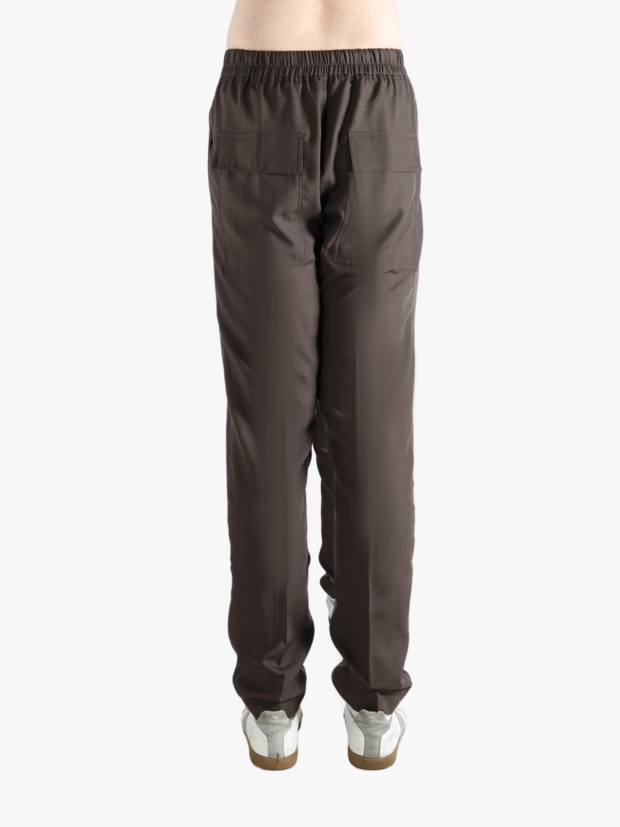 Brown pants worn by a person, showing the pants fit