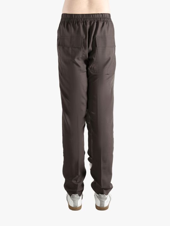 Brown pants worn by a person, showing the pants fit