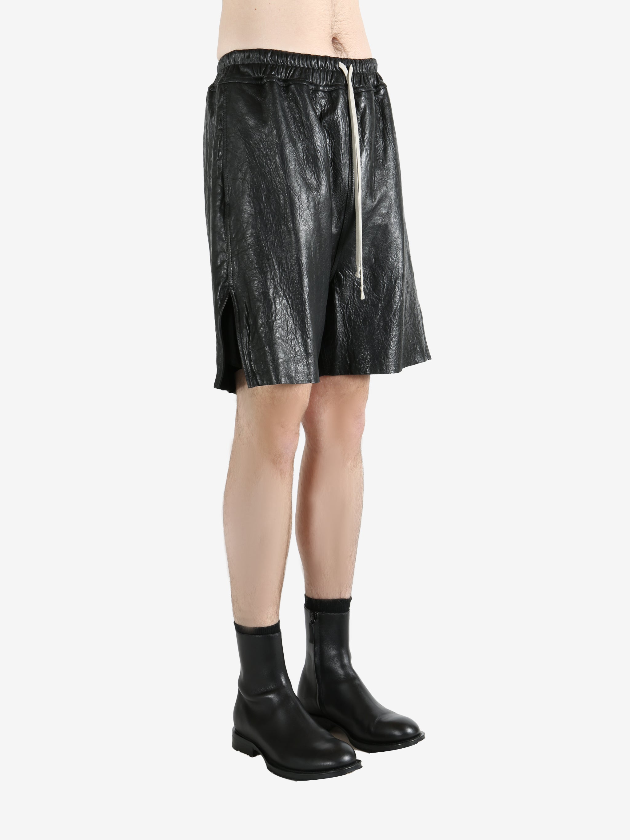 Black shorts worn by a person, showing the shorts' fit