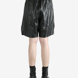 Black shorts worn by a person, showing the shorts' fit