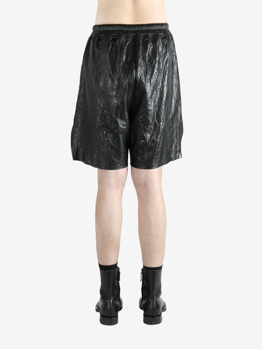 Black shorts worn by a person, showing the shorts' fit