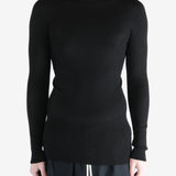 Black shirts worn by a person, showing the shirts fit