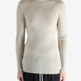 White t-shirt worn by a person, showing the t-shirt fit