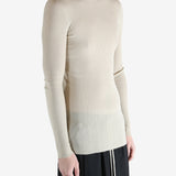 White t-shirt worn by a person, showing the t-shirt fit