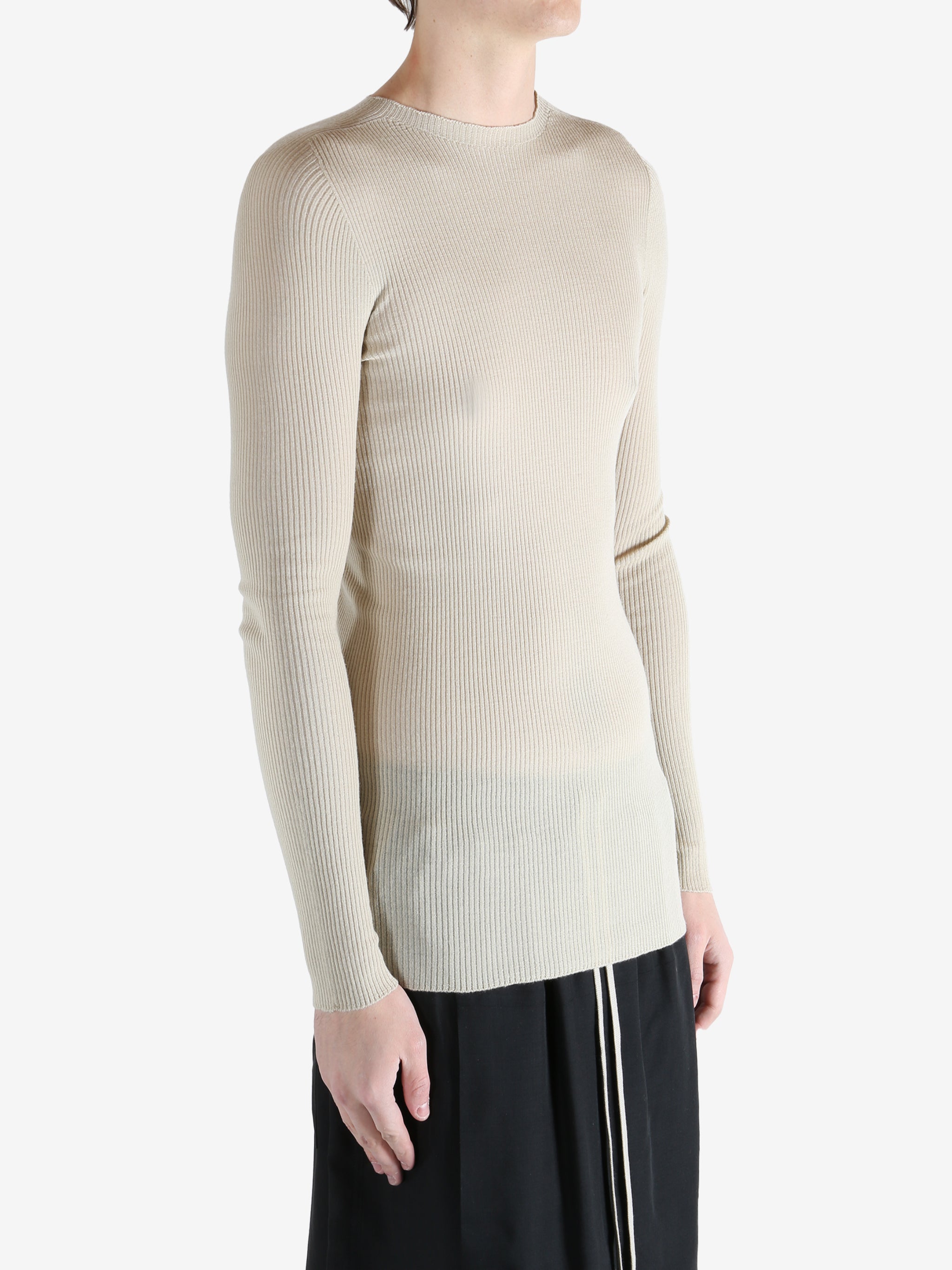 White t-shirt worn by a person, showing the t-shirt fit