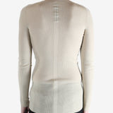 White t-shirt worn by a person, showing the t-shirt fit