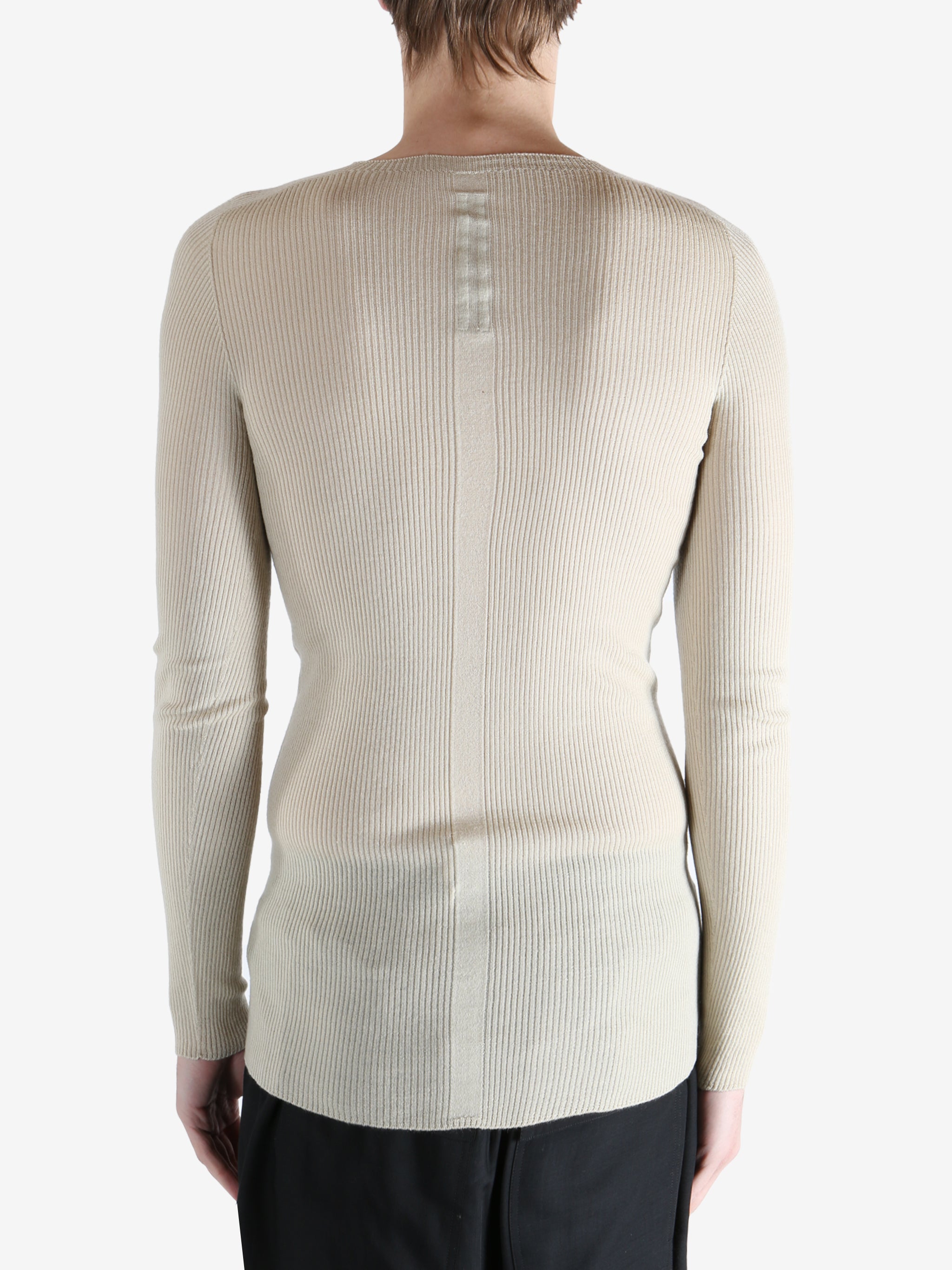 White t-shirt worn by a person, showing the t-shirt fit