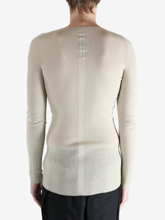 White t-shirt worn by a person, showing the t-shirt fit