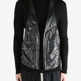 Black vest worn by a person, showing the vest fit