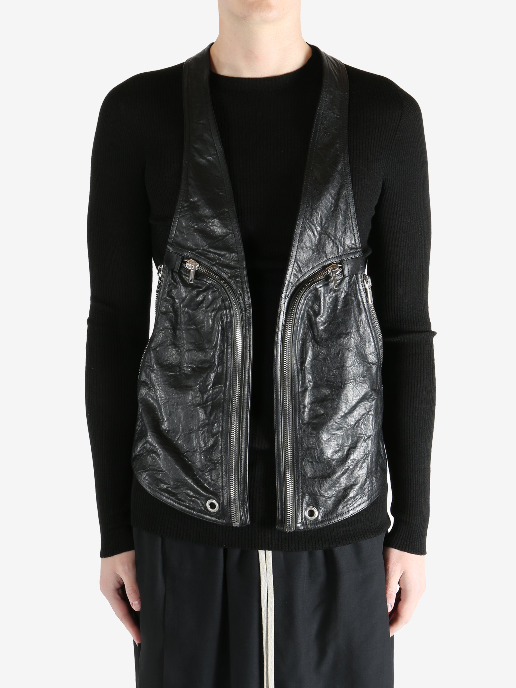 Black vest worn by a person, showing the vest fit