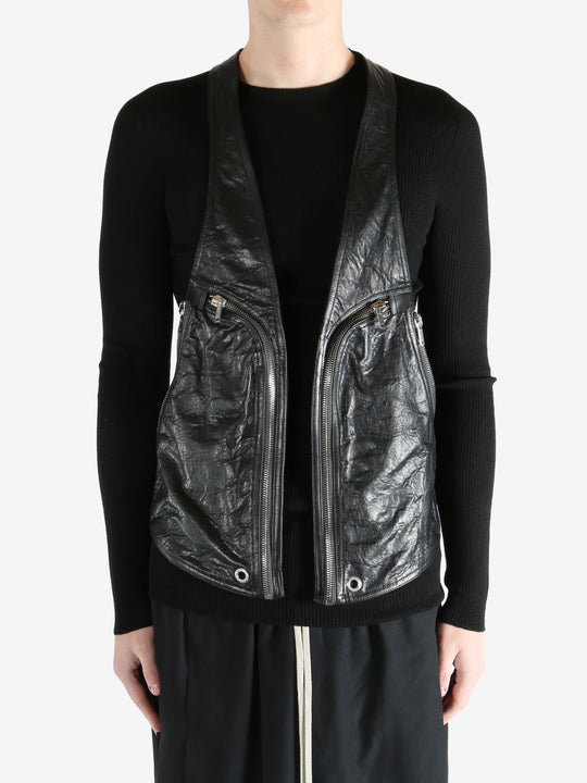 Black vest worn by a person, showing the vest fit