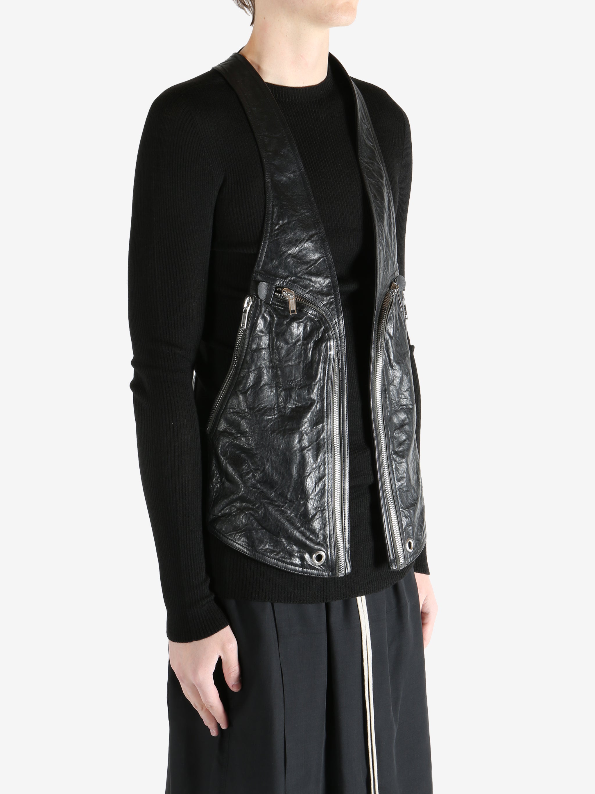 Black vest worn by a person, showing the vest fit