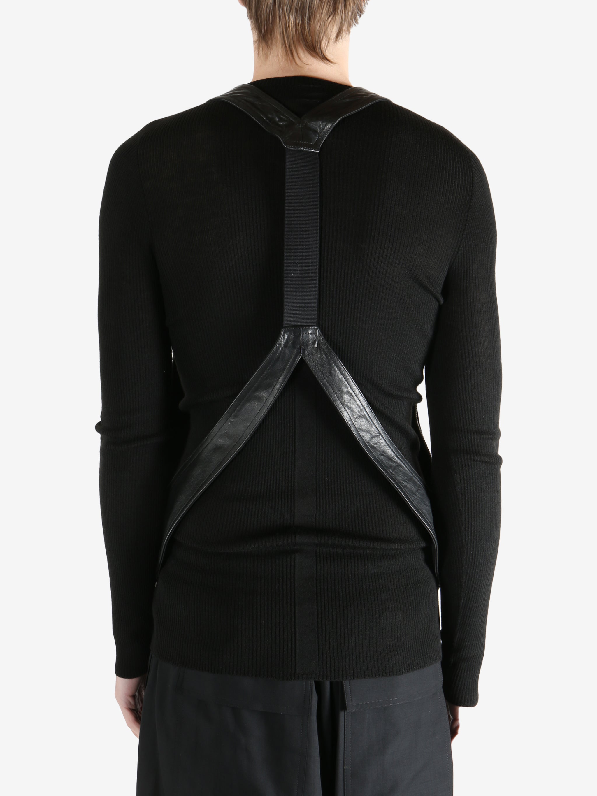 Black vest worn by a person, showing the vest fit