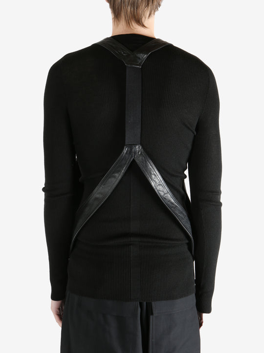 Black vest worn by a person, showing the vest fit