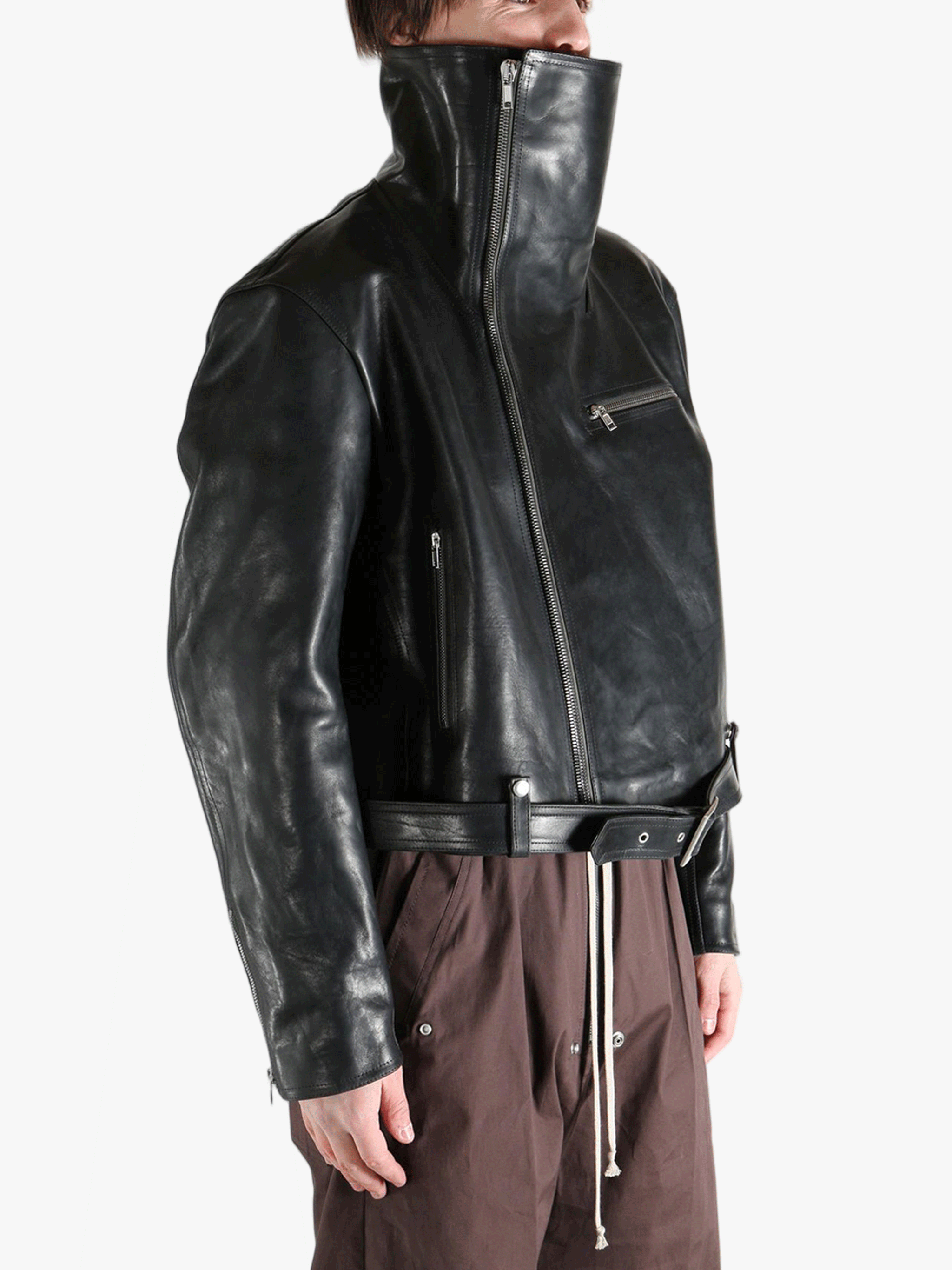 black jacket worn by a person, showing the jacket fit