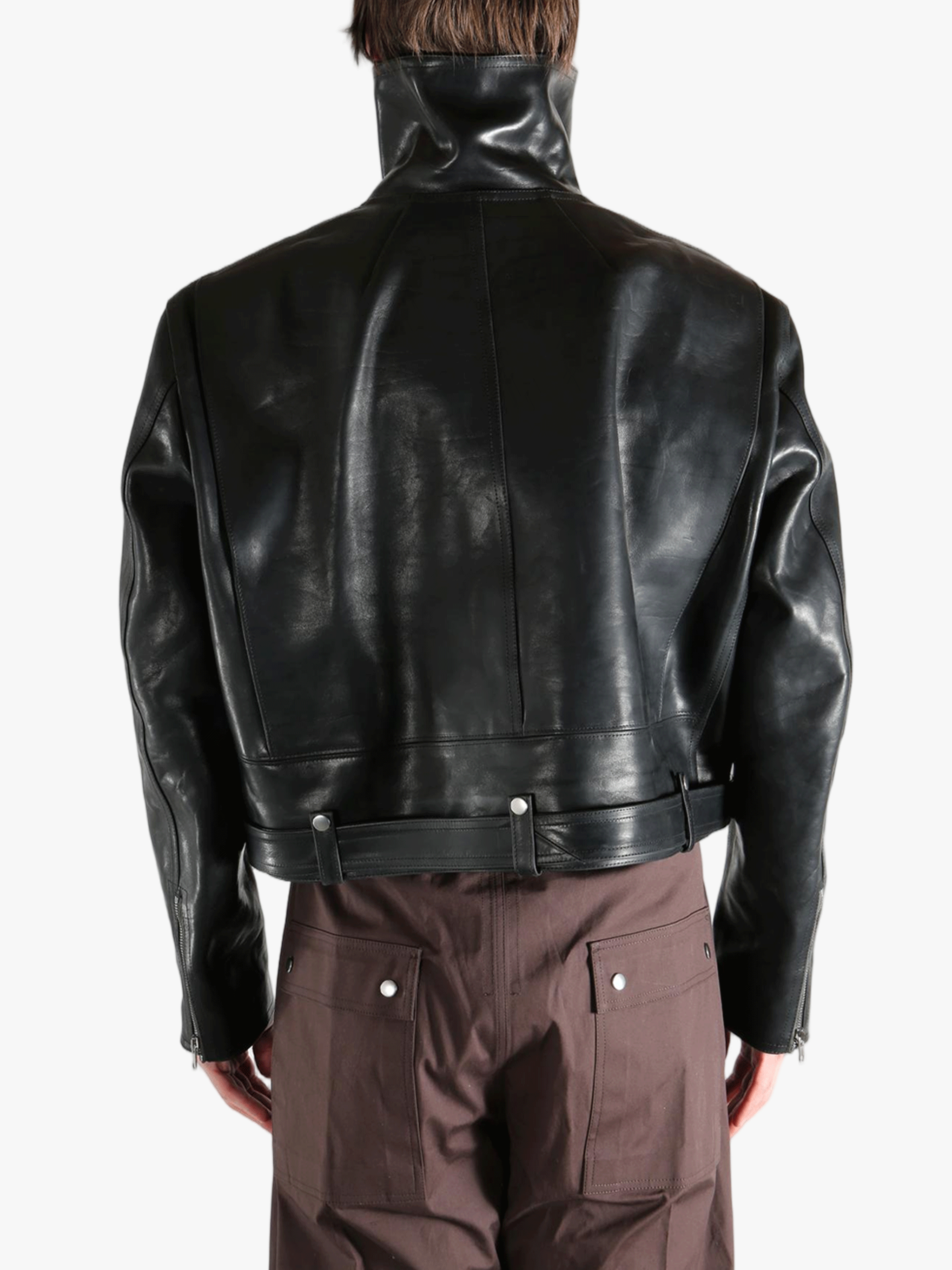 black jacket worn by a person, showing the jacket fit