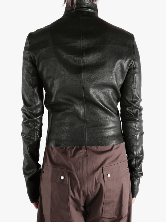 Black jacket worn by a person, showing the jacket fit