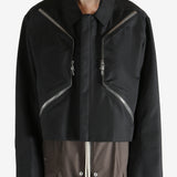 Black jacket worn by a person, showing the jacket fit