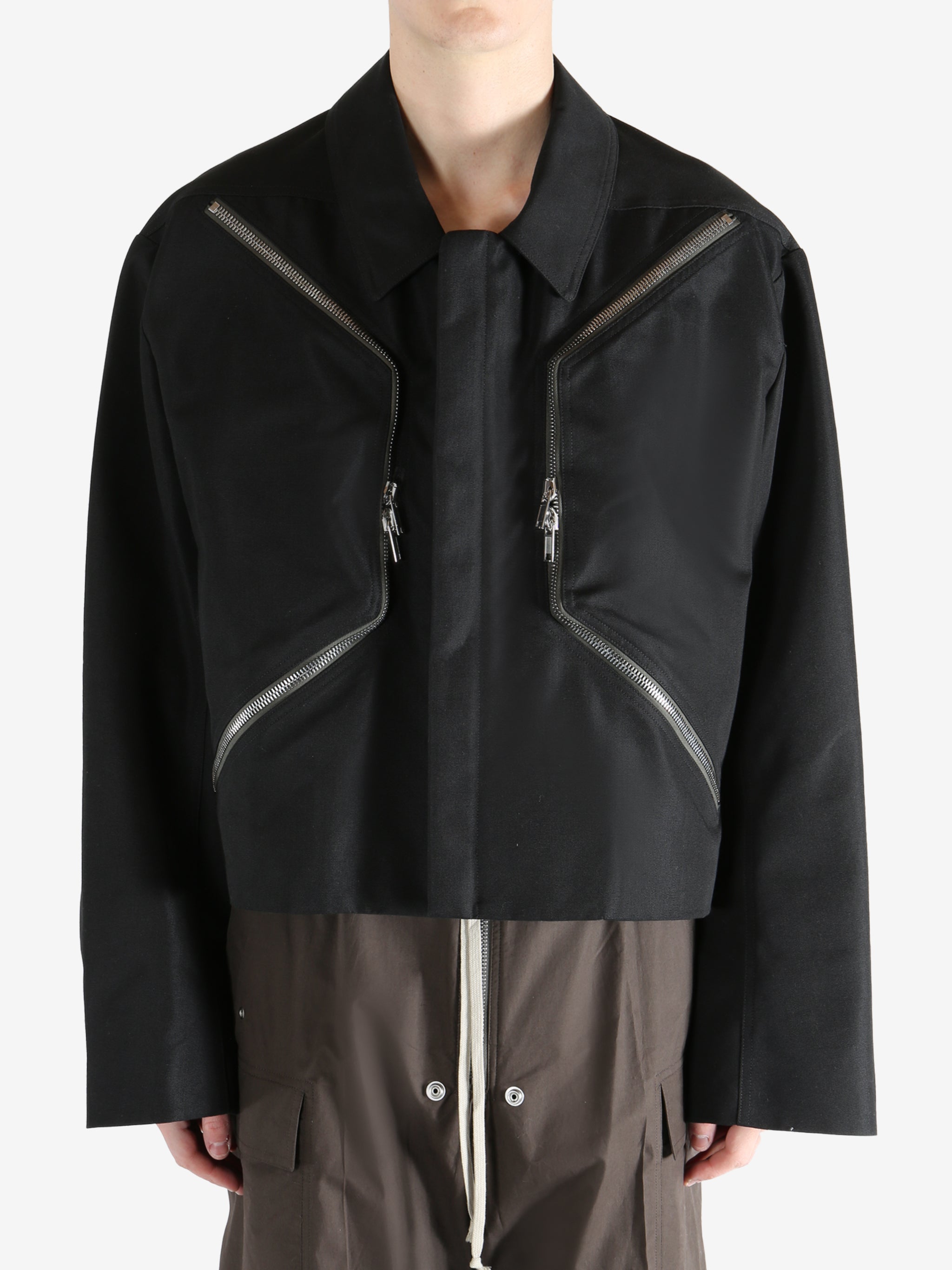 Black jacket worn by a person, showing the jacket fit