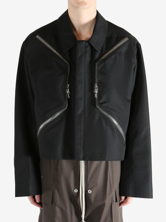 Black jacket worn by a person, showing the jacket fit