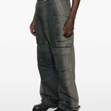 Grey jeans worn by a person, showing the jeans fit