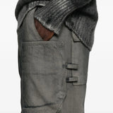 Close up of grey jeans,showing texture of the cotton fabric.