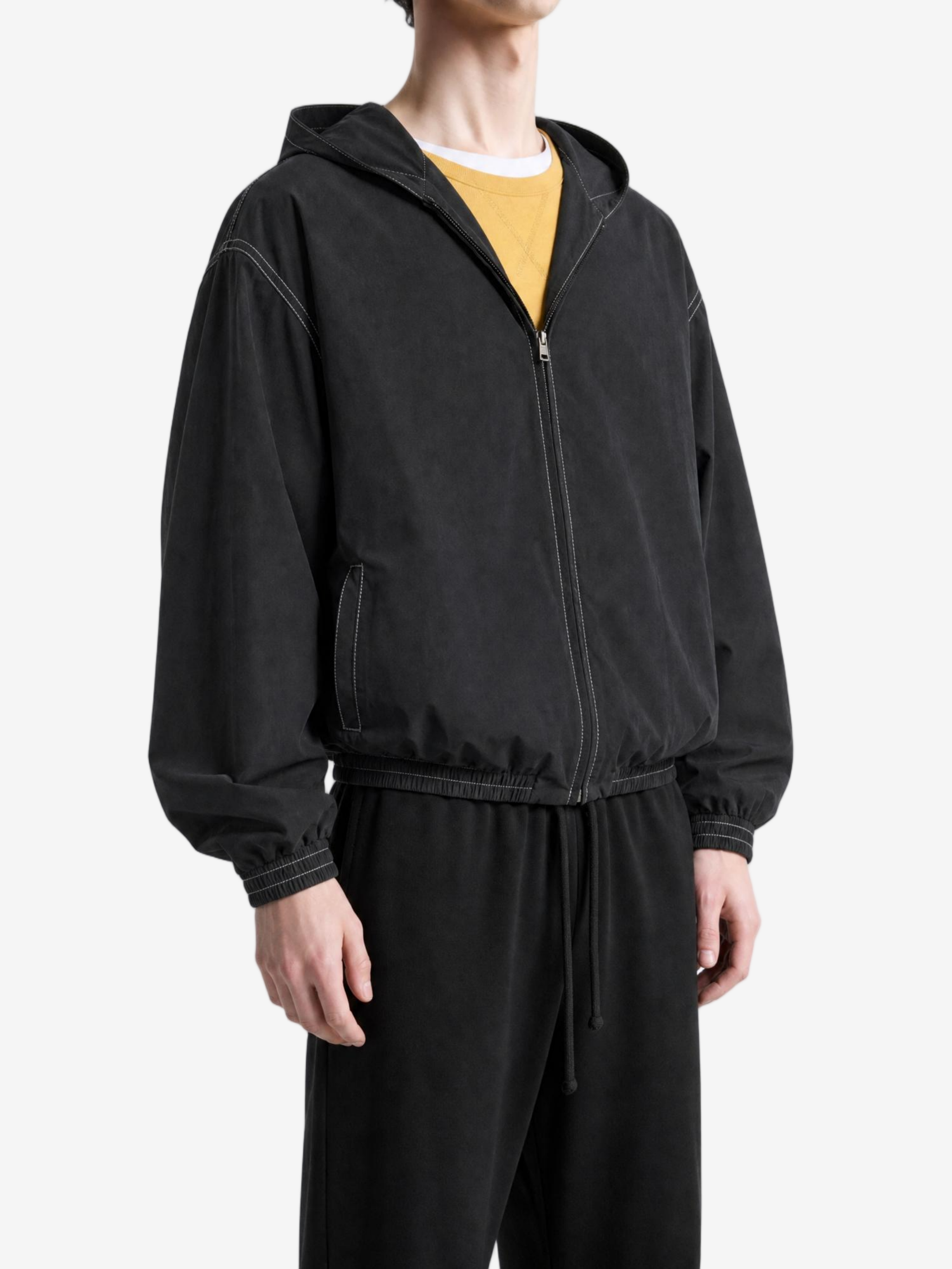Black jacket worn by a person, showing the jacket fit